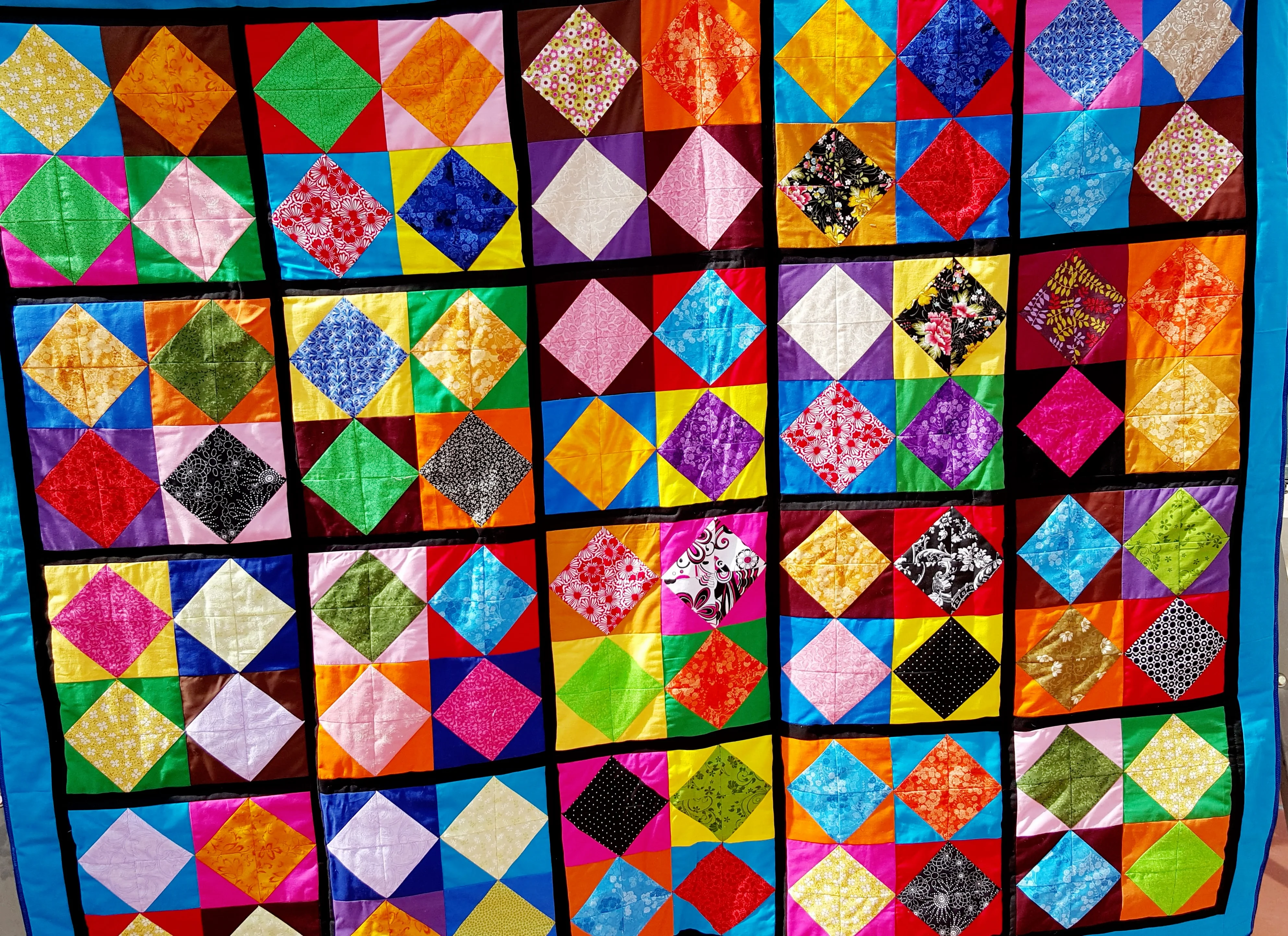 multi-colored diamond pattern quilt